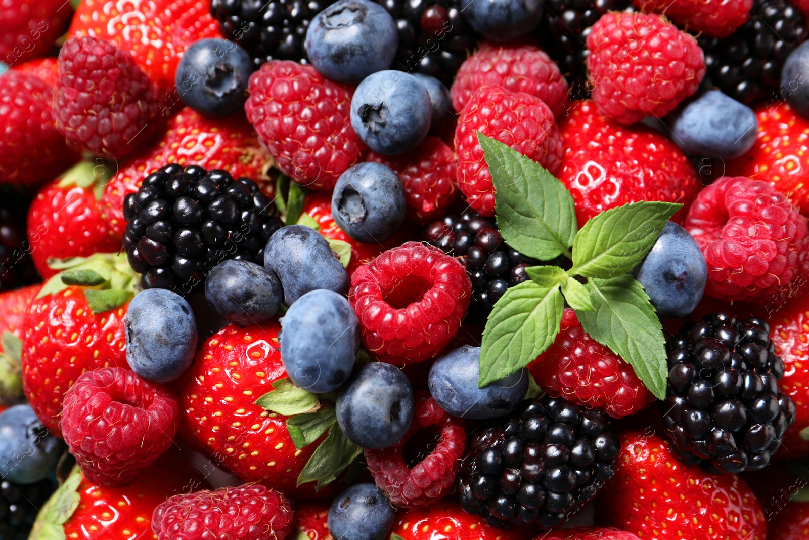 Photo of Many different fresh ripe berries as background, closeup