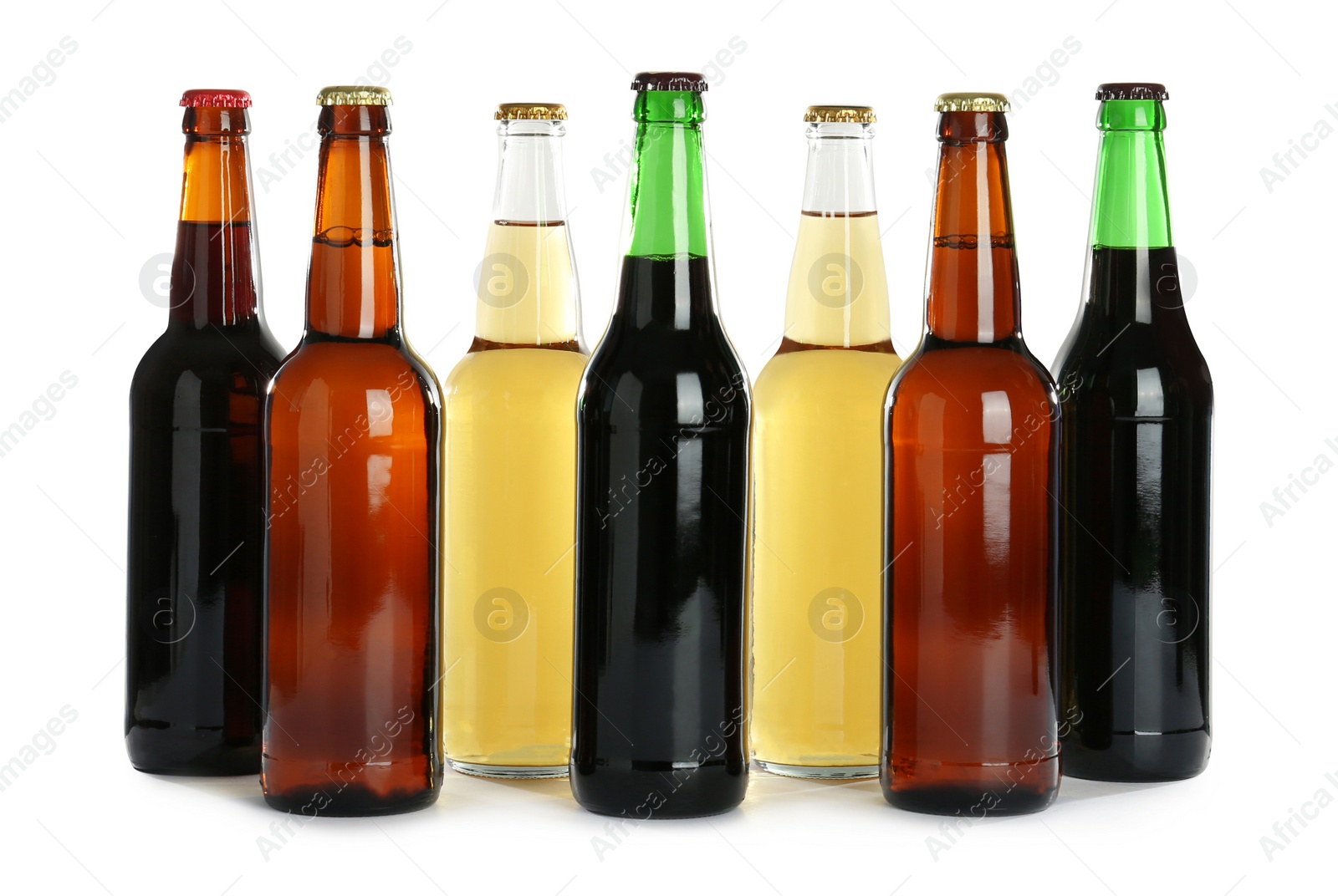 Photo of Bottles with different beer on white background