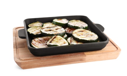 Photo of Grill pan with delicious zucchini slices on white background