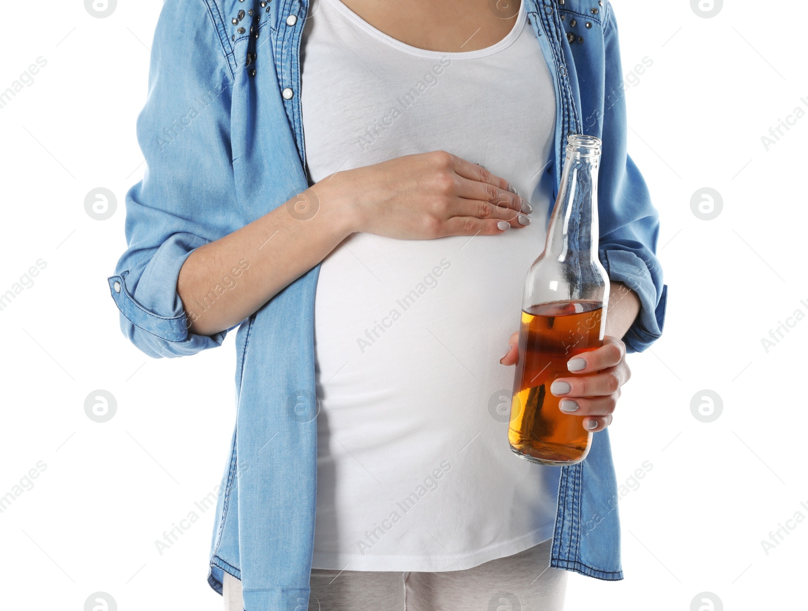 Photo of Future mother with bottle of alcohol drink on white background, closeup. Bad habits during pregnancy