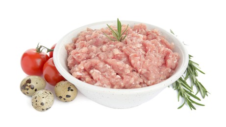 Photo of Raw chicken minced meat with rosemary, quail eggs and tomatoes on white background