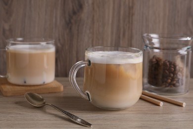 Photo of Cup of fresh coffee on wooden table