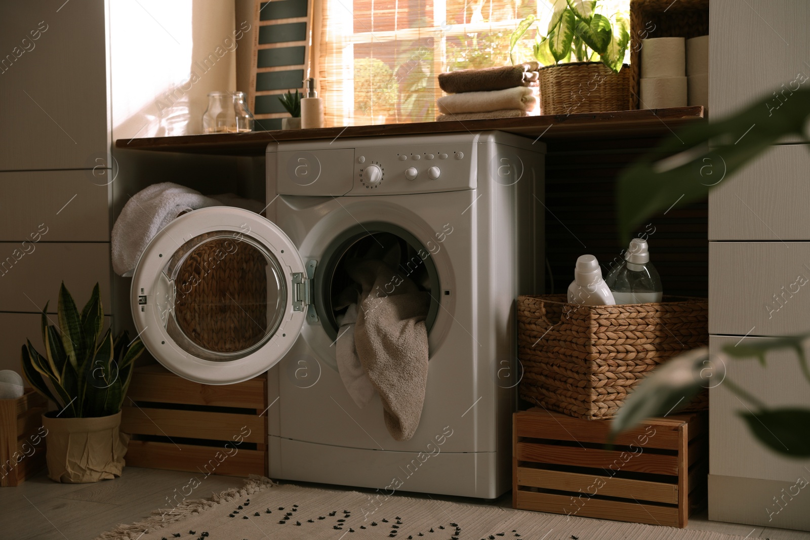 Photo of Stylish room interior with washing machine. Design idea