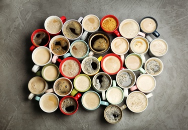 Flat lay composition with cups of coffee on grey background. Food photography