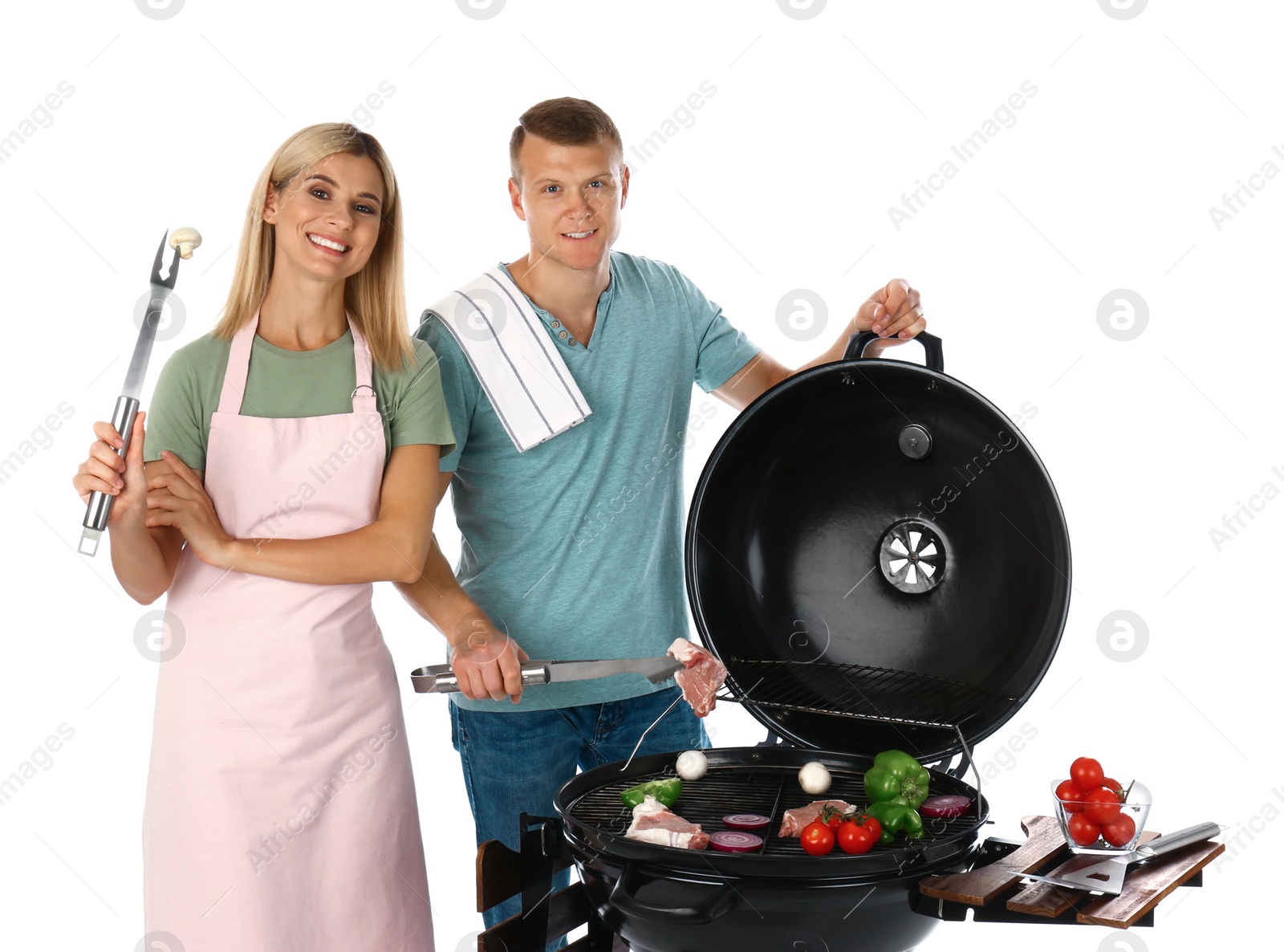 Photo of Happy couple cooking on barbecue grill, white background