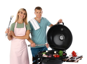 Happy couple cooking on barbecue grill, white background