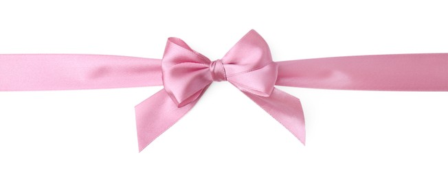 Pink satin ribbon with bow on white background, top view