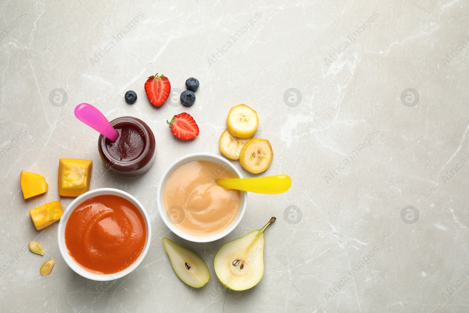 Photo of Healthy baby food and ingredients on grey table, flat lay. Space for text