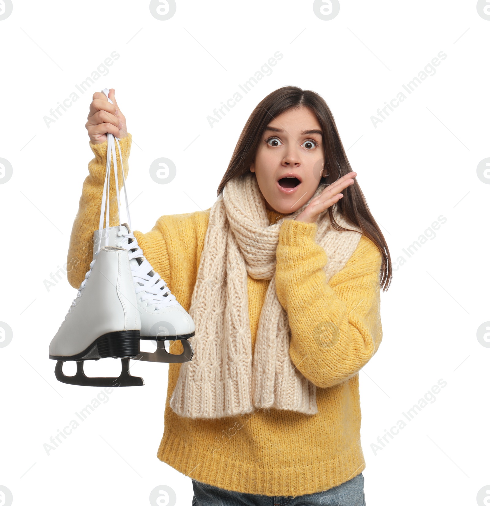 Photo of Emotional woman with ice skates on white background