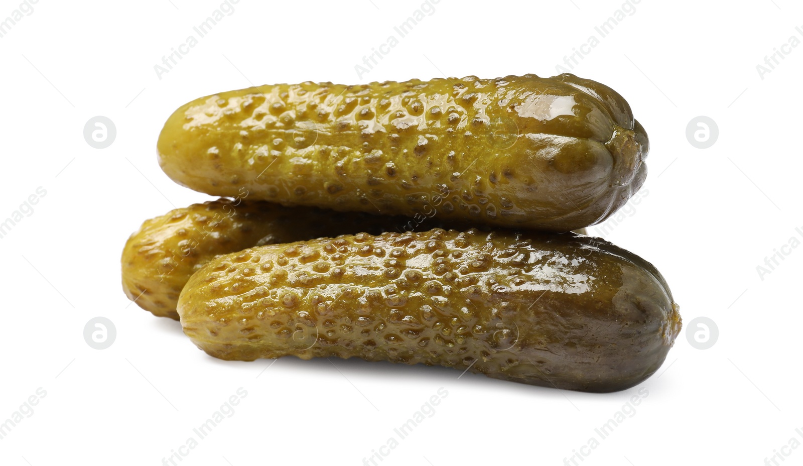 Photo of Pile of tasty pickled cucumbers isolated on white