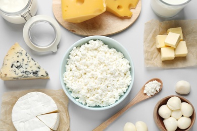 Photo of Different dairy products on light background, flat lay