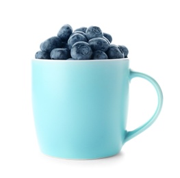 Photo of Cup full of fresh ripe blueberries on white background