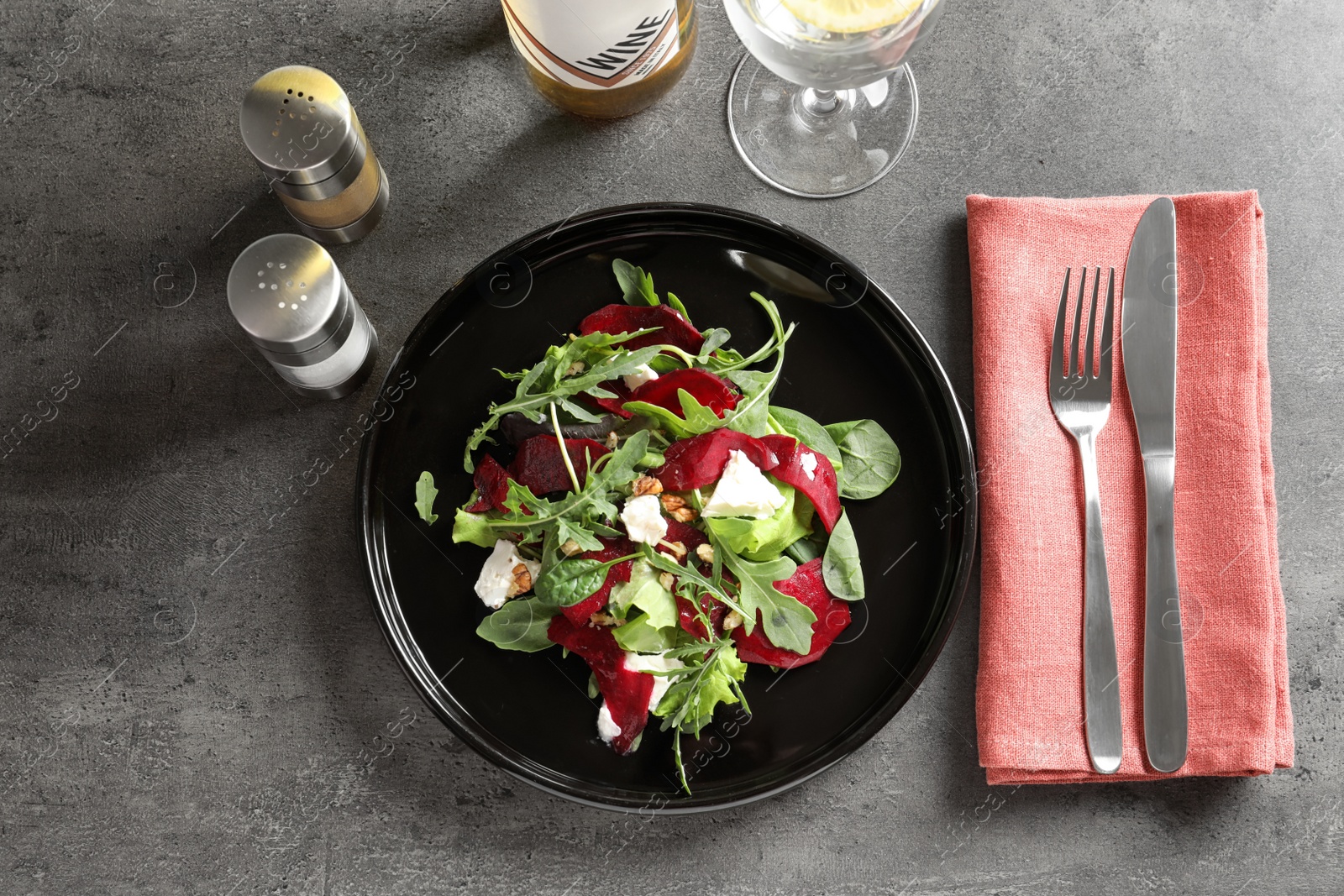 Photo of Plate with delicious beet salad served on table, top view