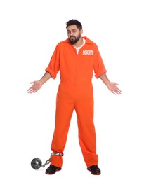 Photo of Prisoner in jumpsuit with metal ball perplexedly shrugging his shoulders on white background