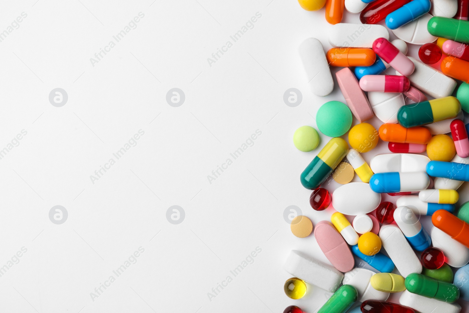 Photo of Different pills on white background, top view