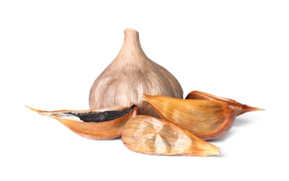 Aged black garlic on white background. Asian cuisine