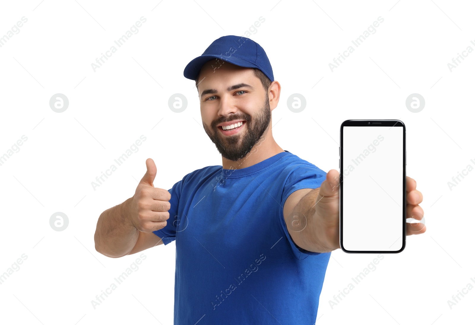 Image of Happy courier holding smartphone with empty screen and showing thumbs up on white background