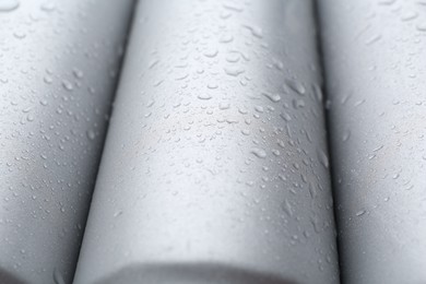 Photo of Energy drinks in wet cans as background, closeup