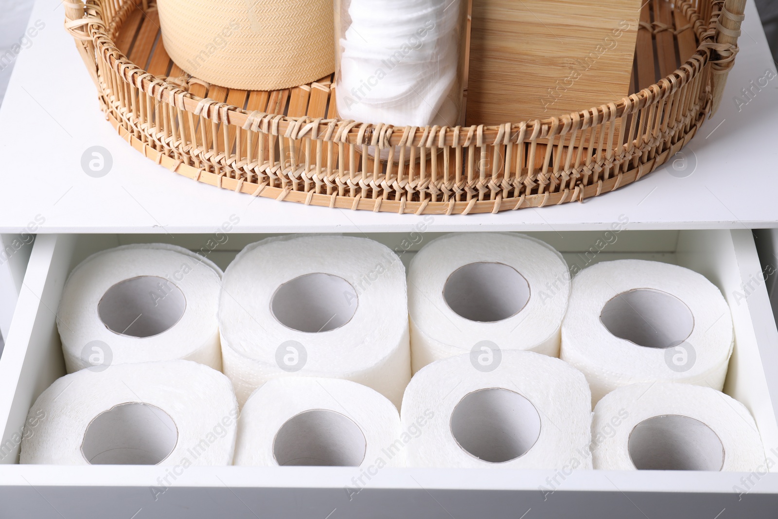 Photo of Many toilet paper rolls in white drawer indoors