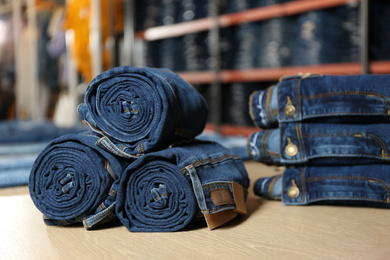 Photo of Rolled modern jeans on display in shop