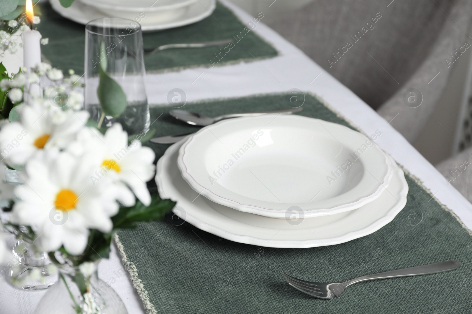 Photo of Elegant festive setting with floral decor on table