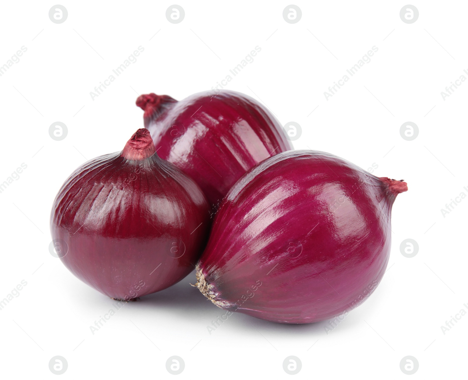 Photo of Fresh whole red onions on white background