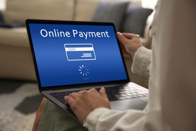 Image of Woman using laptop for online payment at home, closeup