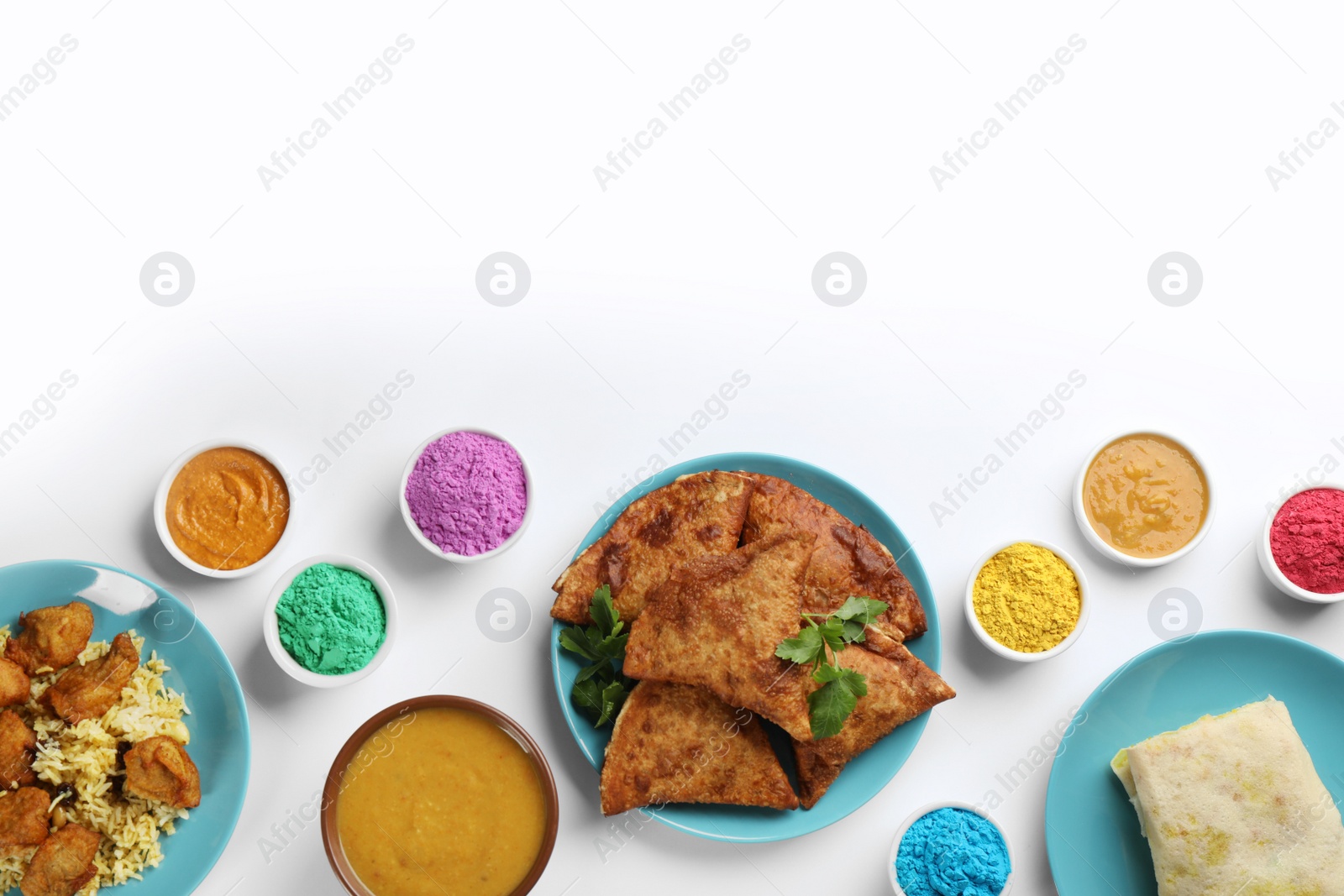 Photo of Flat lay of traditional Indian food and color powder dyes on light background, space for text. Holi festival