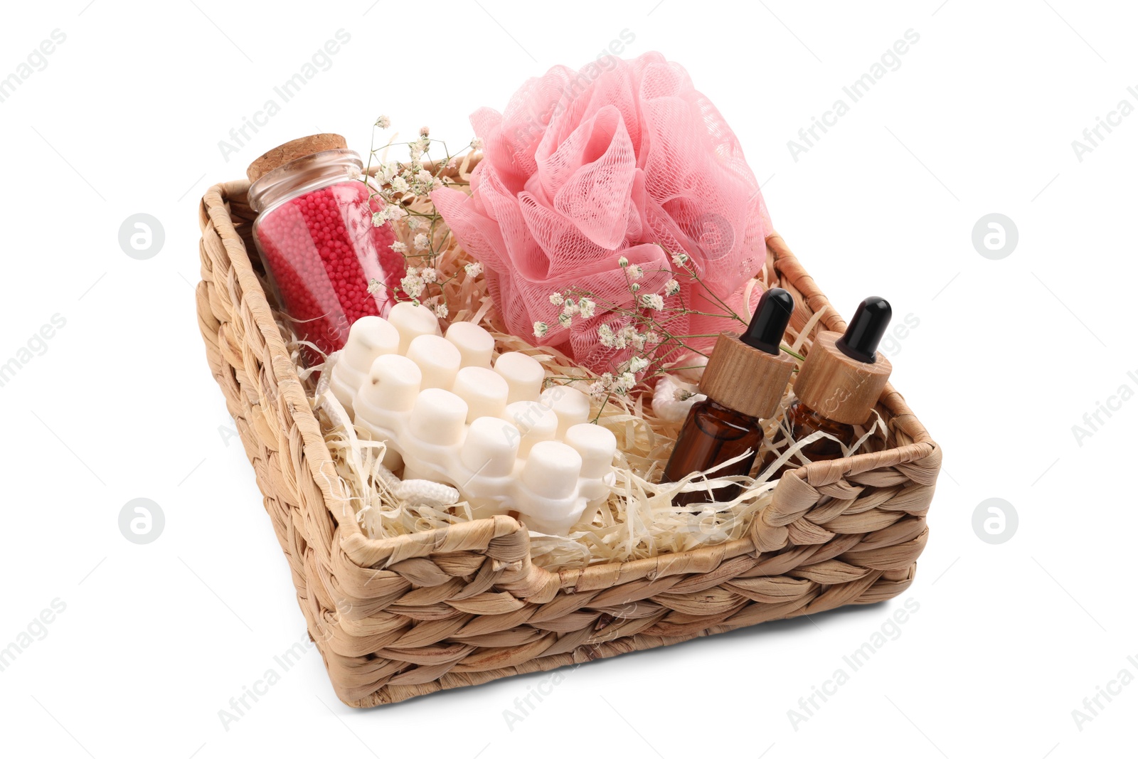 Photo of Spa gift set of different luxury products in wicker basket on white background