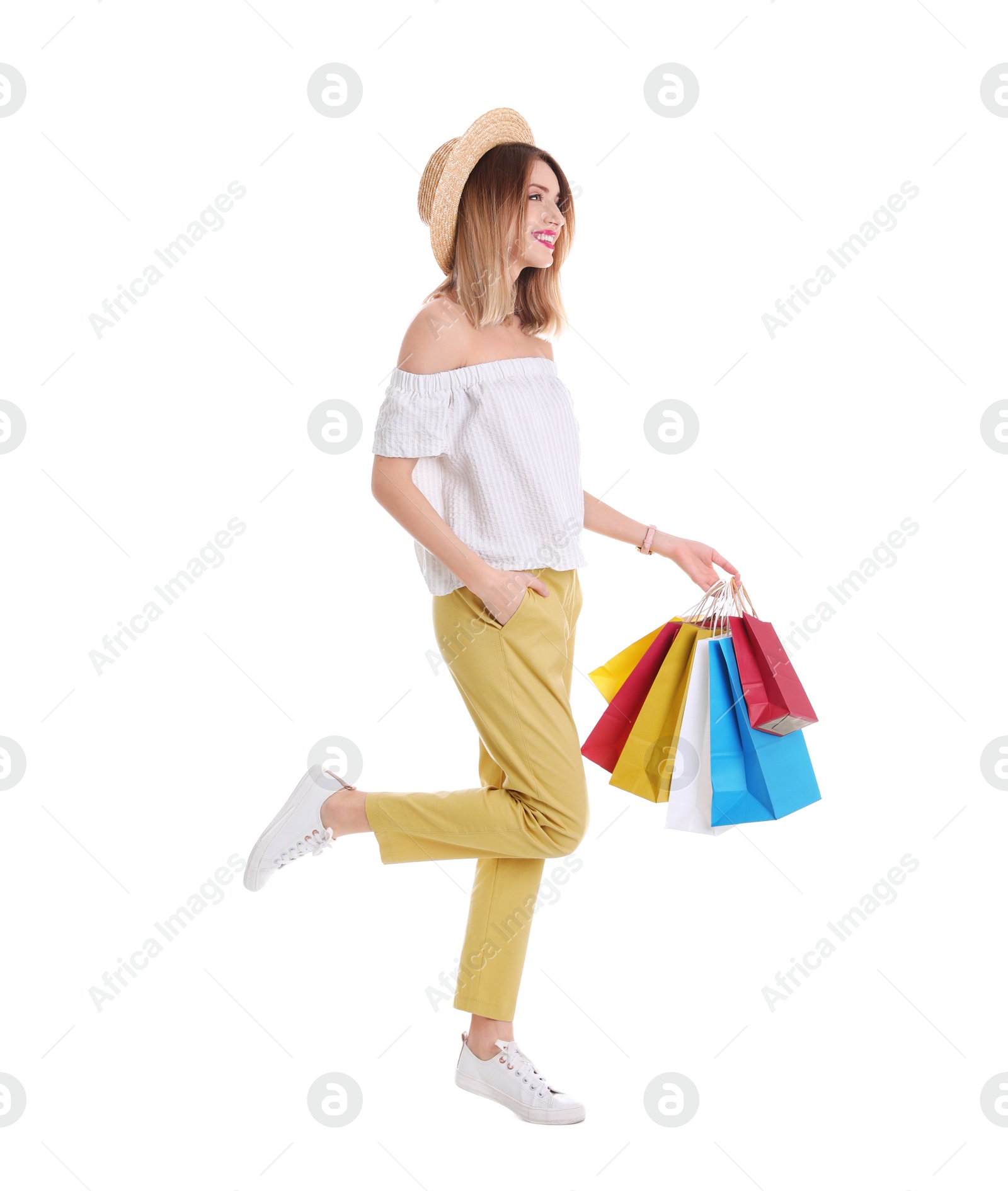 Photo of Beautiful young woman with shopping bags on white background