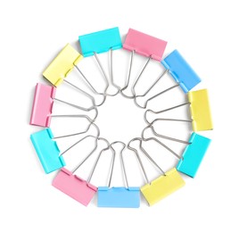 Photo of Colorful binder clips on white background, top view. Stationery item
