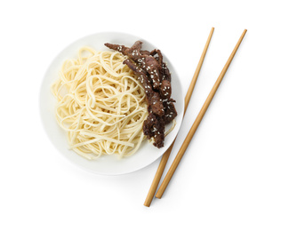 Photo of Tasty cooked rice noodles with meat and chopsticks isolated on white, top view