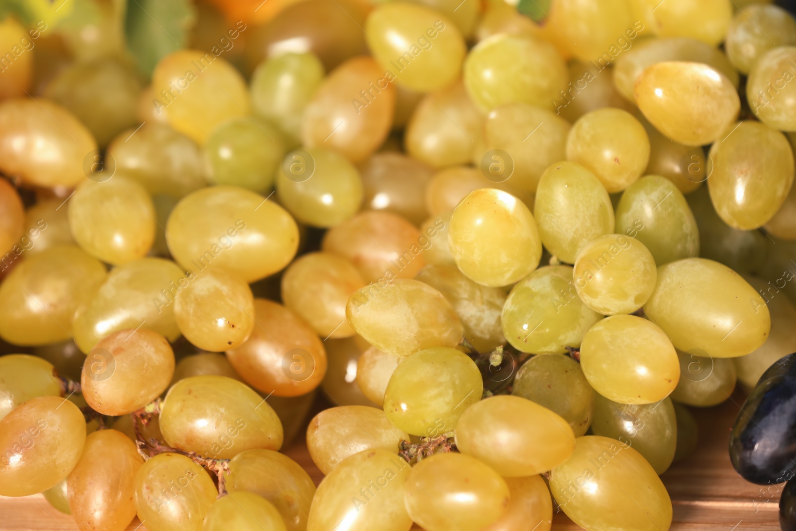 Photo of Fresh ripe juicy grapes on table, closeup