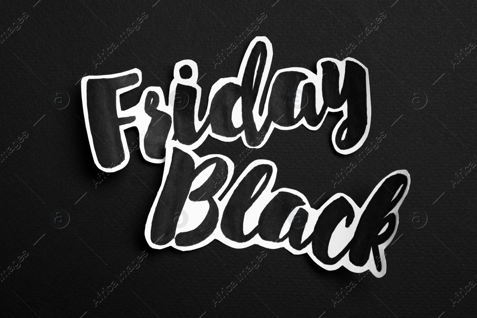 Photo of Phrase Black Friday on dark background, top view
