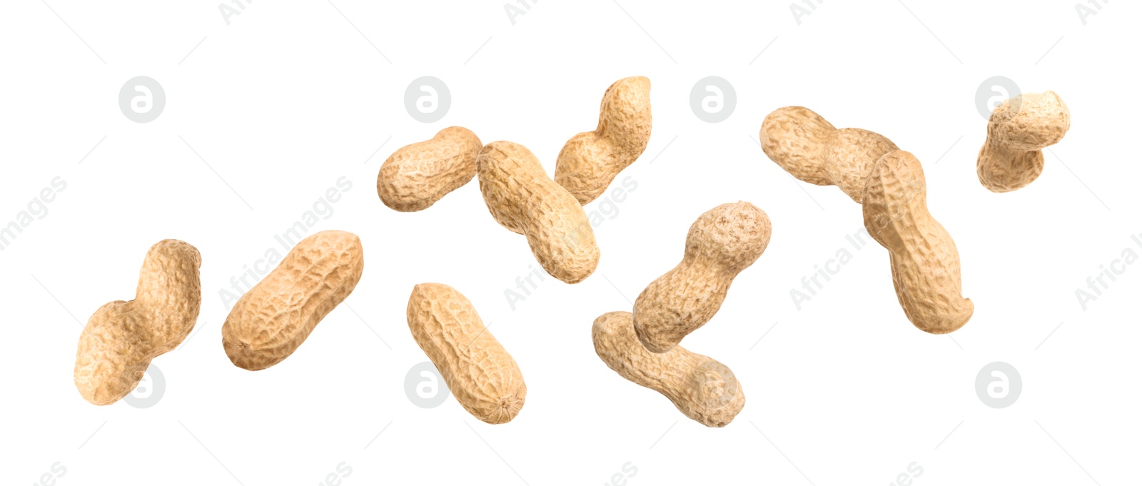 Image of Unpeeled peanuts in air on white background