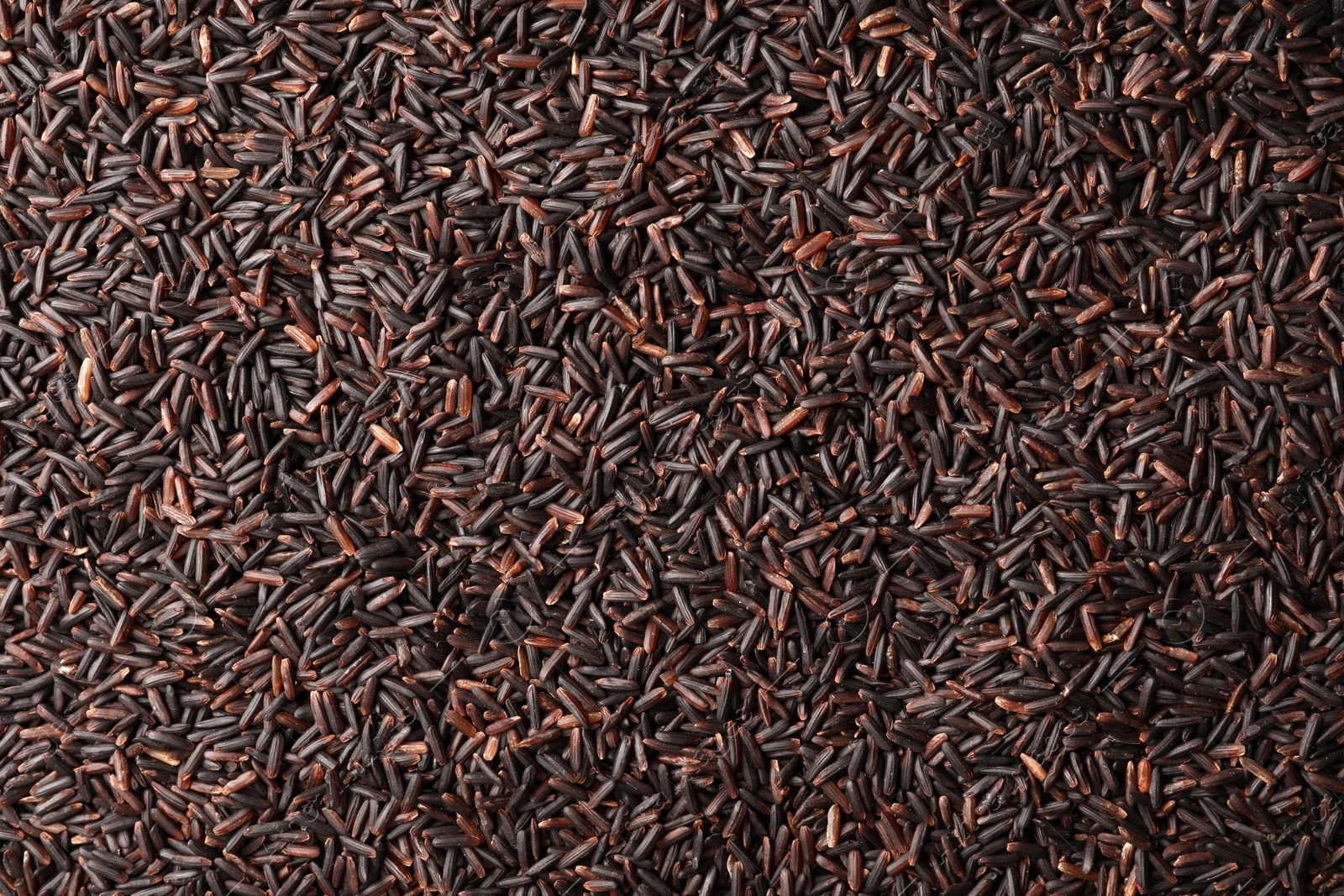 Photo of Raw brown rice as background, top view