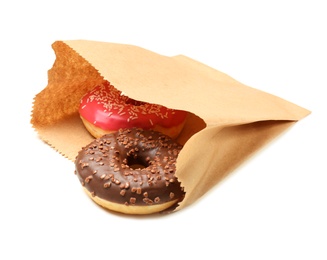 Photo of Paper bag with donuts on white background. Space for design