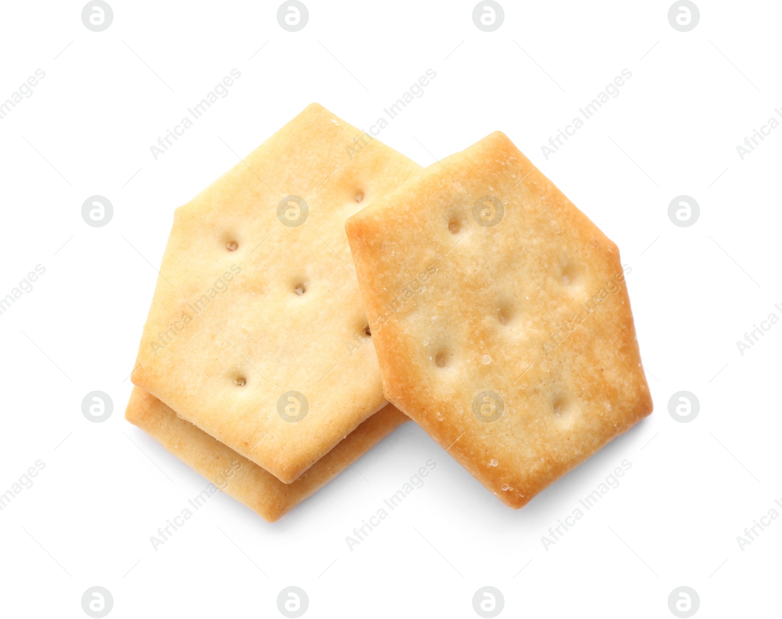 Photo of Crispy crackers isolated on white, above view. Delicious snack