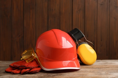 Photo of Composition with different safety equipment on table