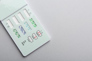 Photo of Multi-drug screen test on light grey background, top view. Space for text