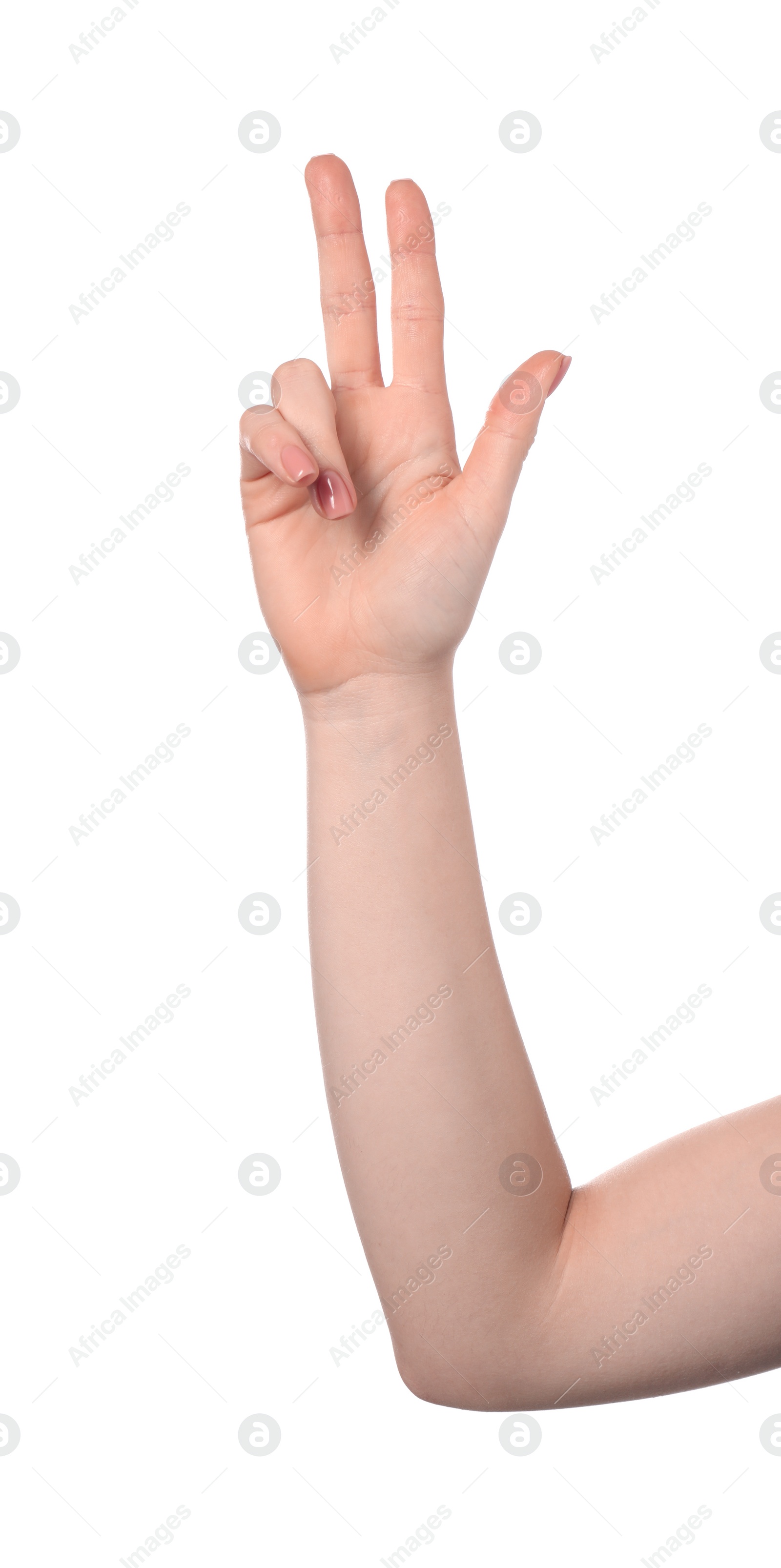 Photo of Playing rock, paper and scissors. Woman making scissors with her fingers on white background, closeup