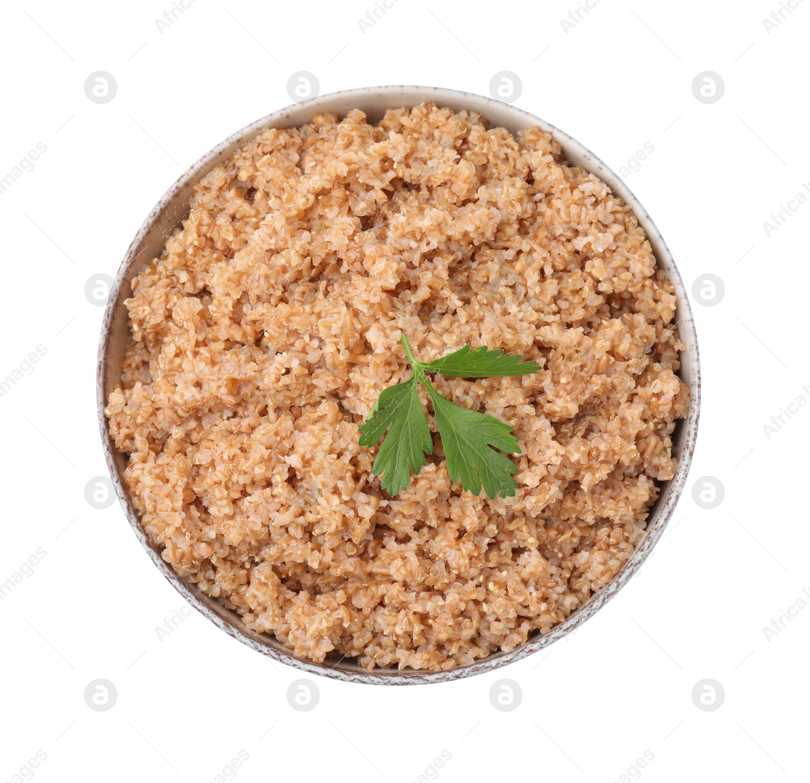 Photo of Tasty wheat porridge with parsley in bowl isolated on white, top view