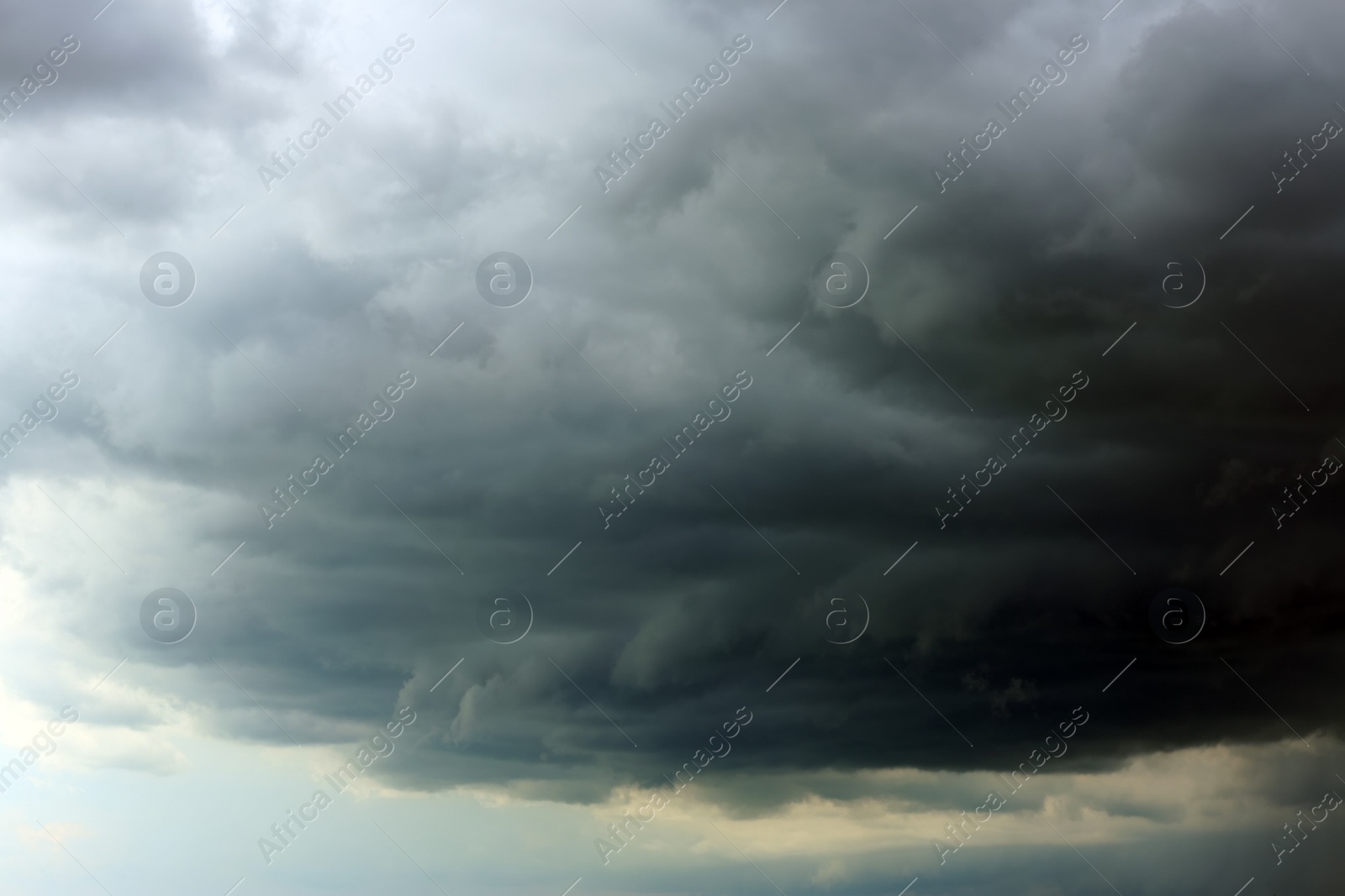 Photo of Sky with heavy rainy clouds on grey day