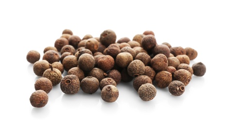 Allspice pepper grains on white background. Natural spice