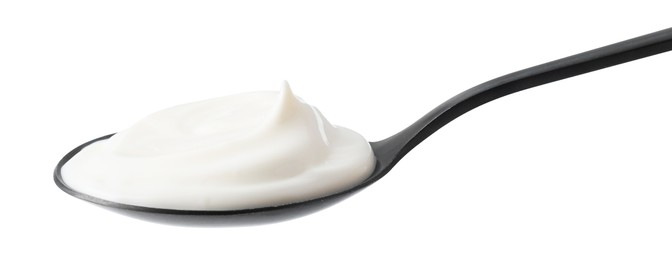 One black spoon with mayonnaise isolated on white