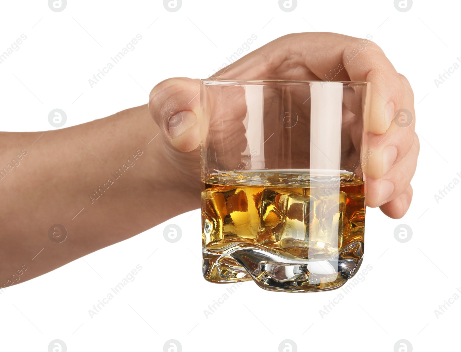 Photo of Man holding glass of whiskey with ice cubes on white background, closeup