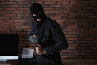 Photo of Dangerous masked criminal stealing money from house