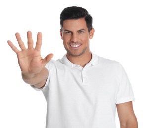 Photo of Man showing number five with his hand on white background