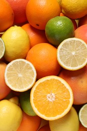 Photo of Different fresh citrus fruits as background, top view