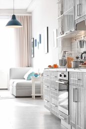 Photo of Modern kitchen interior in light apartment